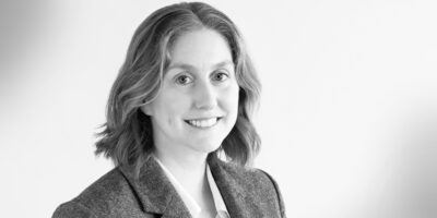 Black and white headshot of Maggie Daly, attorney in Fishman Haygood's litigation section